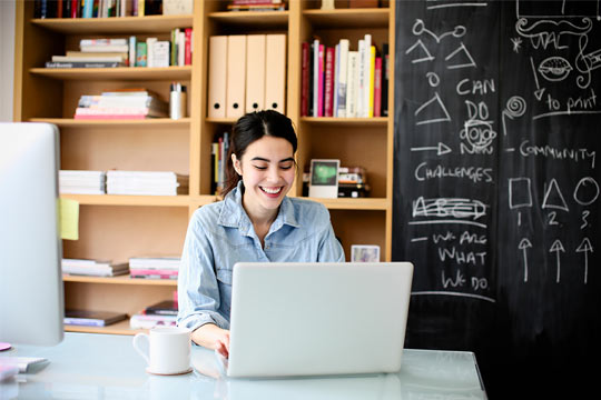 Graphic designer using laptop at workStock Photo Stock Photo